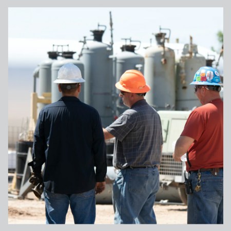 workers have a discussion on site