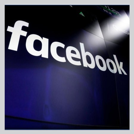 a projected Facebook logo