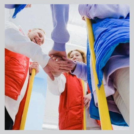 photo showing people clasping hands in union