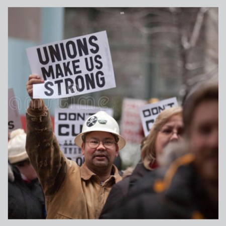 a man holding a sign that says "unions make us strong"